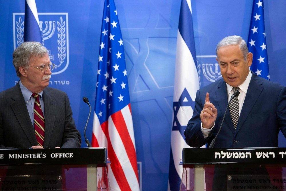 Israeli Prime Minister Benjamin Netanyahu, right, speaks during a press conference with visiting US National Security Adviser John Bolton at the Prime Minister’s office in Jerusalem on Monday. — AFP