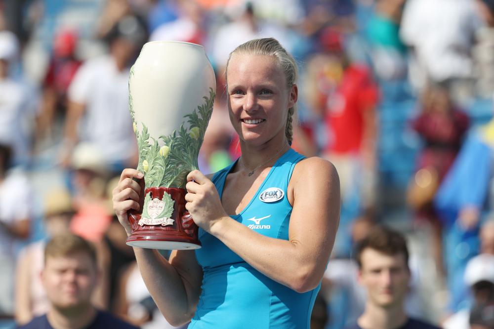 Kiki Bertens of the Netherlands holds the trophy after defeating Simona Halep of Romania at the Western and Southern Open in Cincinnati Sunday. — AFP