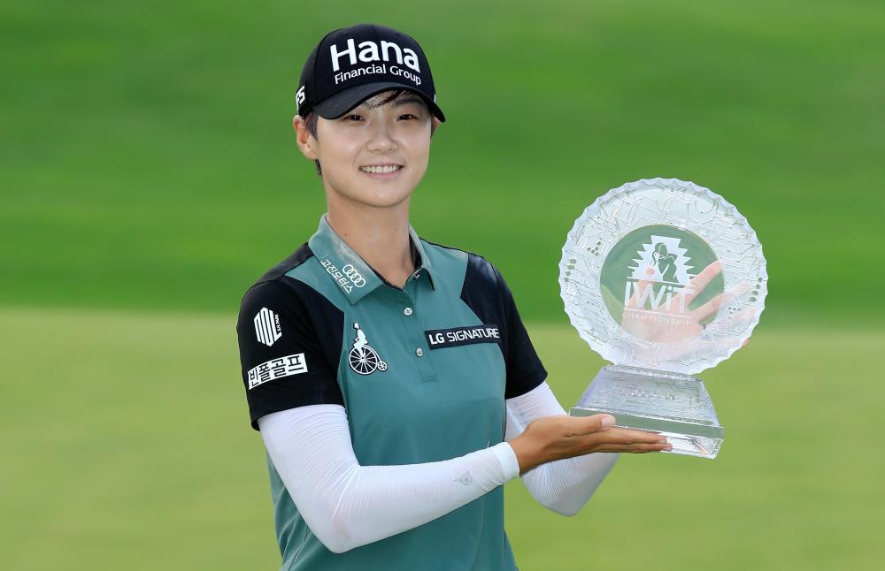 Park Sung-yun of South Korea holds the winner's trophy at the Indy Women In Tech Championship Driven by Group 1001 at the Brickyard Crossing Golf Club in Indianapolis Sunday. — AFP 