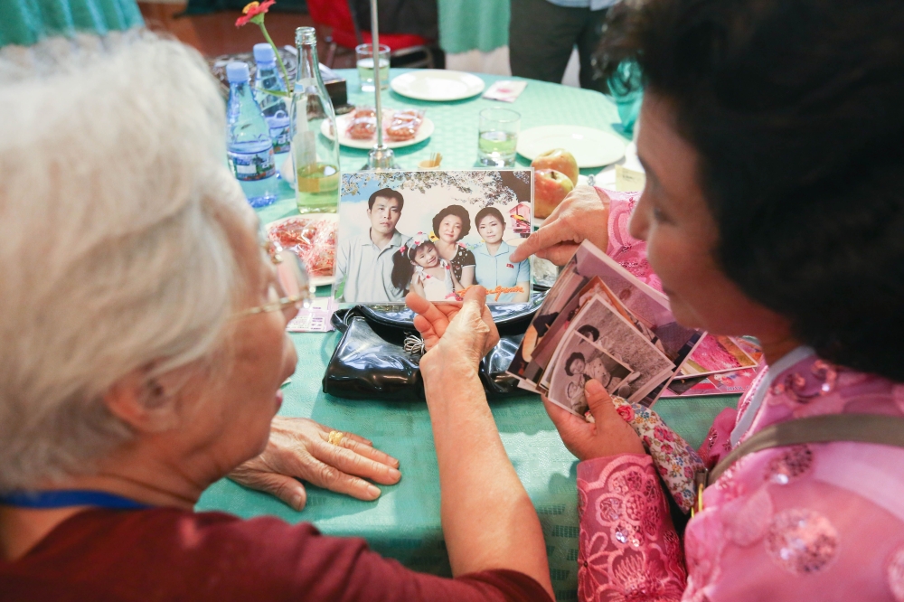 South Korean Jeon Hye-ok, left, 90, talks with her North Korean niece Kim Yoon Kyong, right, 56, during a separated family reunion meeting at the Mount Kumgang resort on the North’s southeastern coast on Monday. — AFP