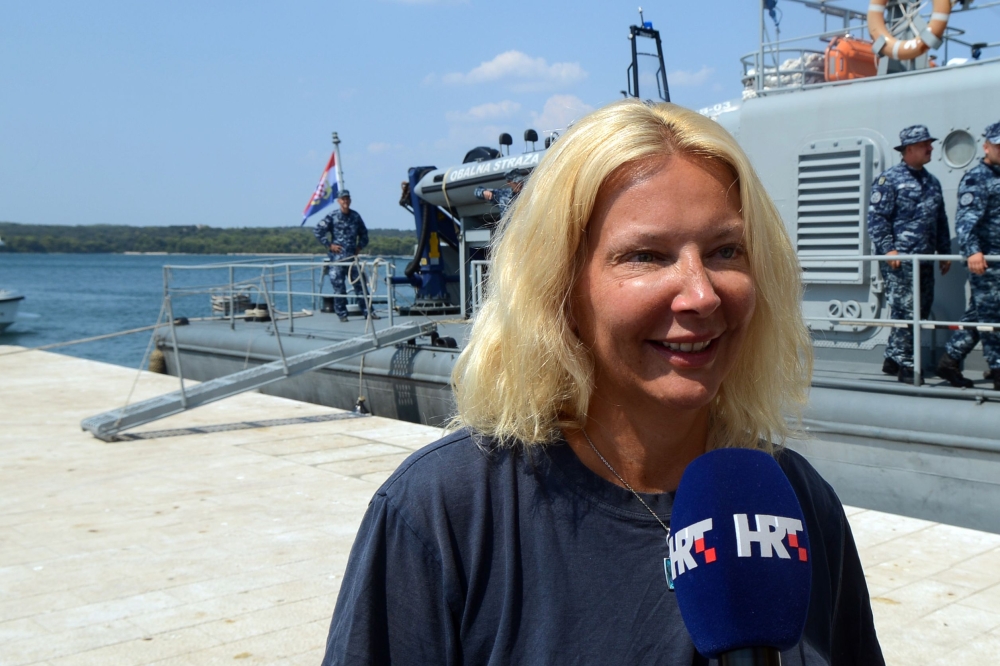 British tourist Kay Longstaff speaks to the press upon her arrival in Pula with the Croatia’s coast guard ship, on Sunday, which saved her after falling off a cruise ship near Croatian coast. — AFP