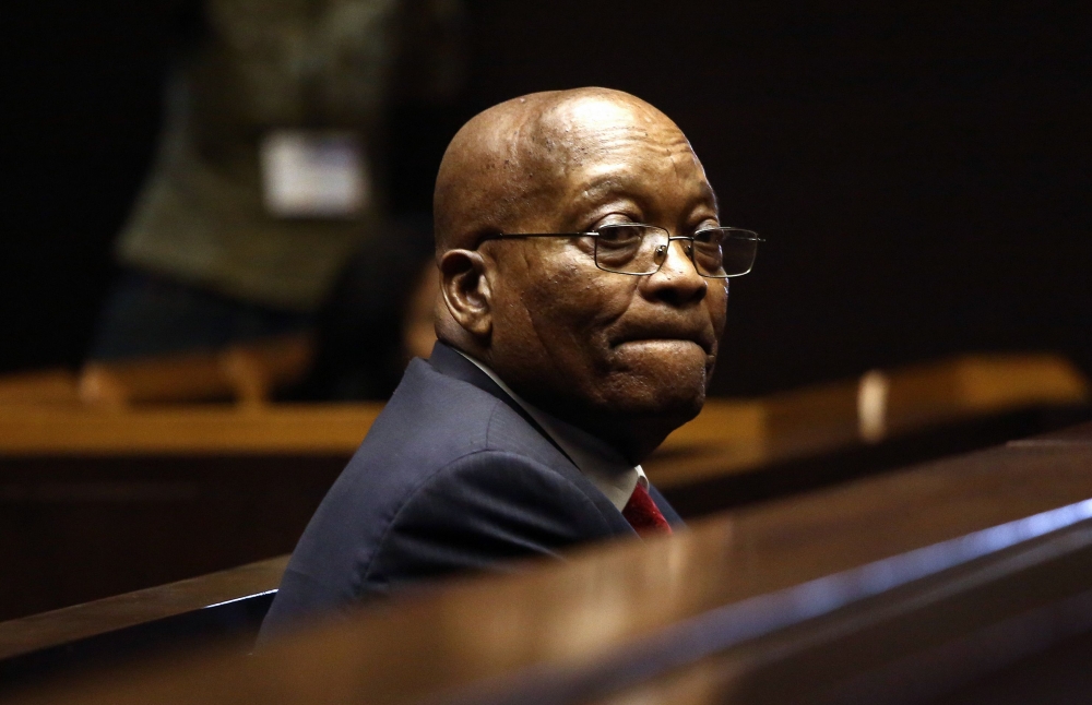 Former South African President Jacob Zuma stands in the dock of the High Court of Pietermaritzburg during his hearing over 16 corruption charges in this July 27, 2018 file photo. — AFP