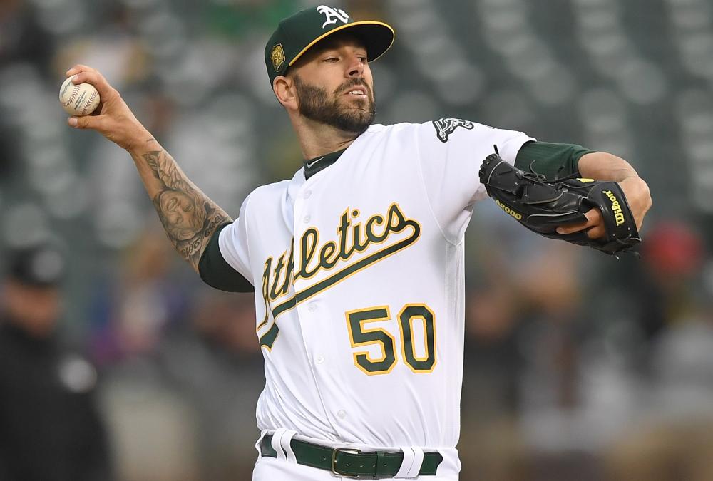 Mike Fiers of the Oakland Athletics pitches against the Texas Rangers in the top of the first inning at Oakland Alameda Coliseum Monday. — AFP 