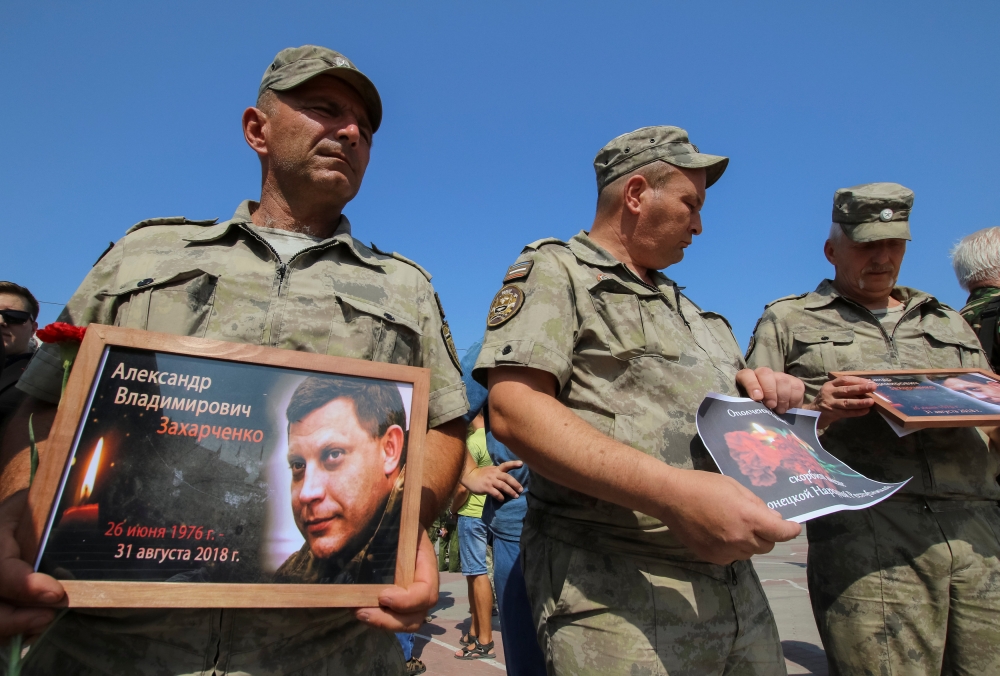 Members of the People's Militia of Crimea commemorate the leader of the separatist self-proclaimed Donetsk People's Republic Alexander Zakharchenko, who was assassinated in Donetsk, in Simferopol, Crimea on Saturday. — Reuters