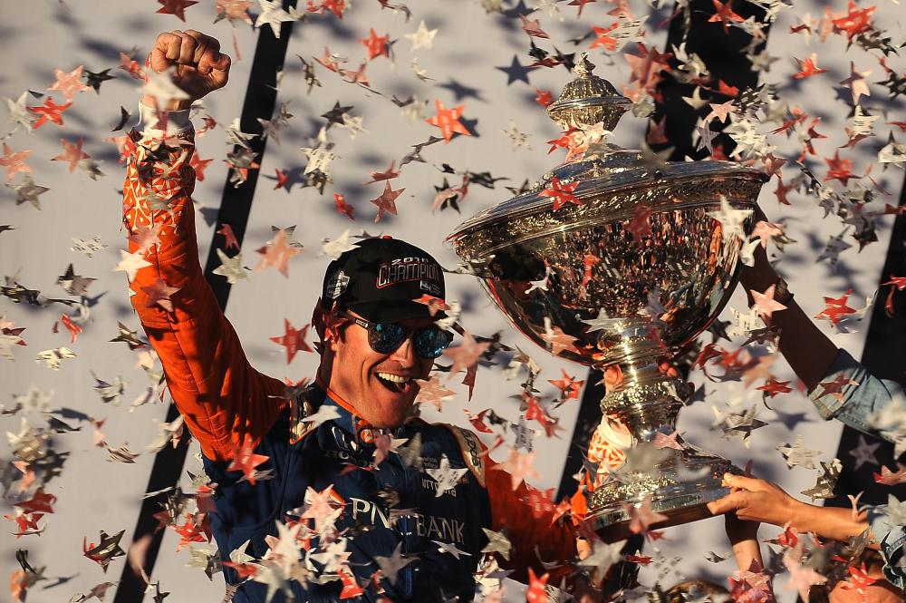 Scott Dixon, driver of the #9 Chip Ganassi Racing Honda, celebrates in Victory Lane with the Verizon IndyCar Series Championship Trophy after the IndyCar Series Sonoma Grand Prix in Sonoma, California, Sunday. — AFP