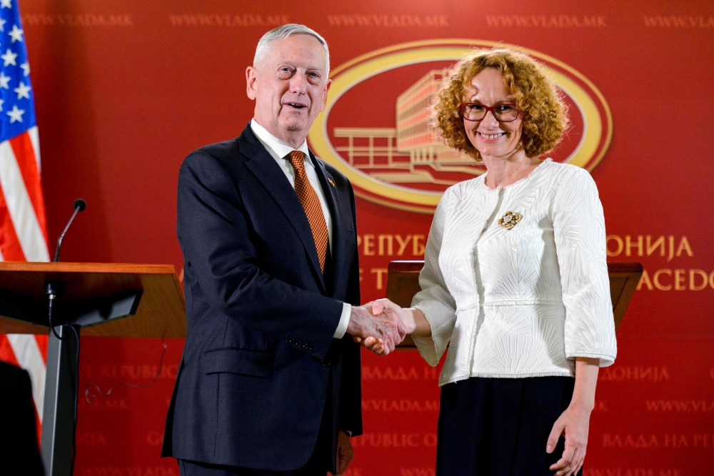 US Defense Secretary James Mattis, left, shakes hands with Macedonian Minister of Defense Radmila Sekerinska, right, after a joint press conference following their meeting in Skopje on Monday. — AFP