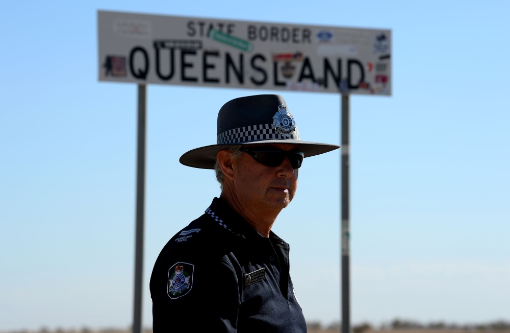 Australian police Senior Constable Stephan Pursell patrols a remote border area of Queensland and South Australia outside the outback town of Birdsville. In this isolated, arid, ferrous-red-and-orange moonscape fringing the Simpson Desert, dust, pesky flies, feral camels, wild dogs and deadly snakes are your main companions. - AFP
