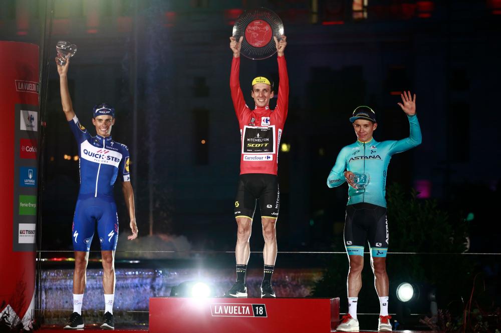 Mitchelton-Scott’s British cyclist Simon Philip Yates (C), Quick Step Floors’ Spanish cyclist Enric Mas (L) and Team Astana’s Colombian cyclist Miguel Angel Lopez celebrate on the podium of the 73rd edition of “La Vuelta” Tour of Spain cycling race in Madrid Sunday. — AFP 