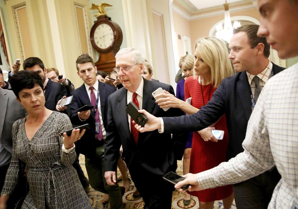 


Senate Majority Leader Mitch McConnell answers questions from reporters about Supreme Court nominee Brett Kavanaugh on Capitol Hill in Washington on Monday. — AFP