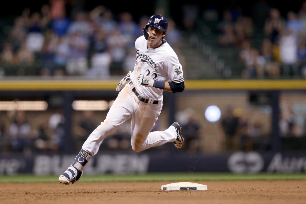 


Christian Yelich of the Milwaukee Brewers runs to third base for a triple in the sixth inning against the Cincinnati Reds at Miller Park in Milwaukee, Wisconsin, Monday. — AFP