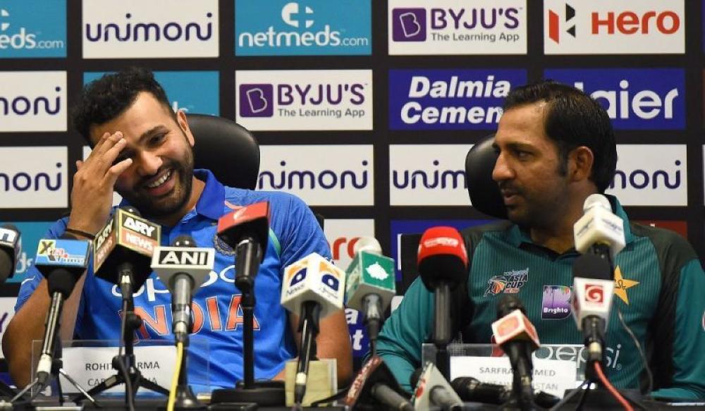 


Rival captains Sarfraz Ahmed (R) of Pakistan and Rohit Sharma of India during press conference on Monday. — AFP