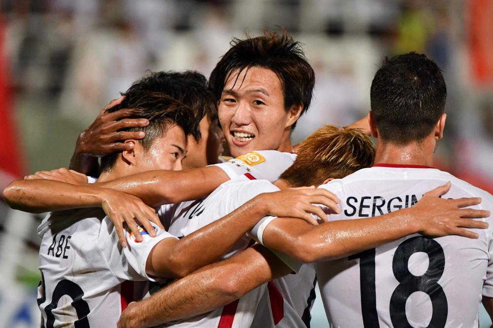 Kashima Antlers' Hiroki Abe celebrates his goal with teammates during the Asian Champions League quarterfinal match against China's Tianjin Quanjian in Macau Tuesday. — AFP 