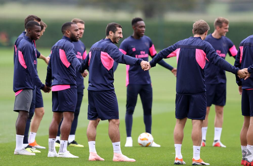 


Arsenal players in a training session at St Albans, England Tuesday. — Reuters 