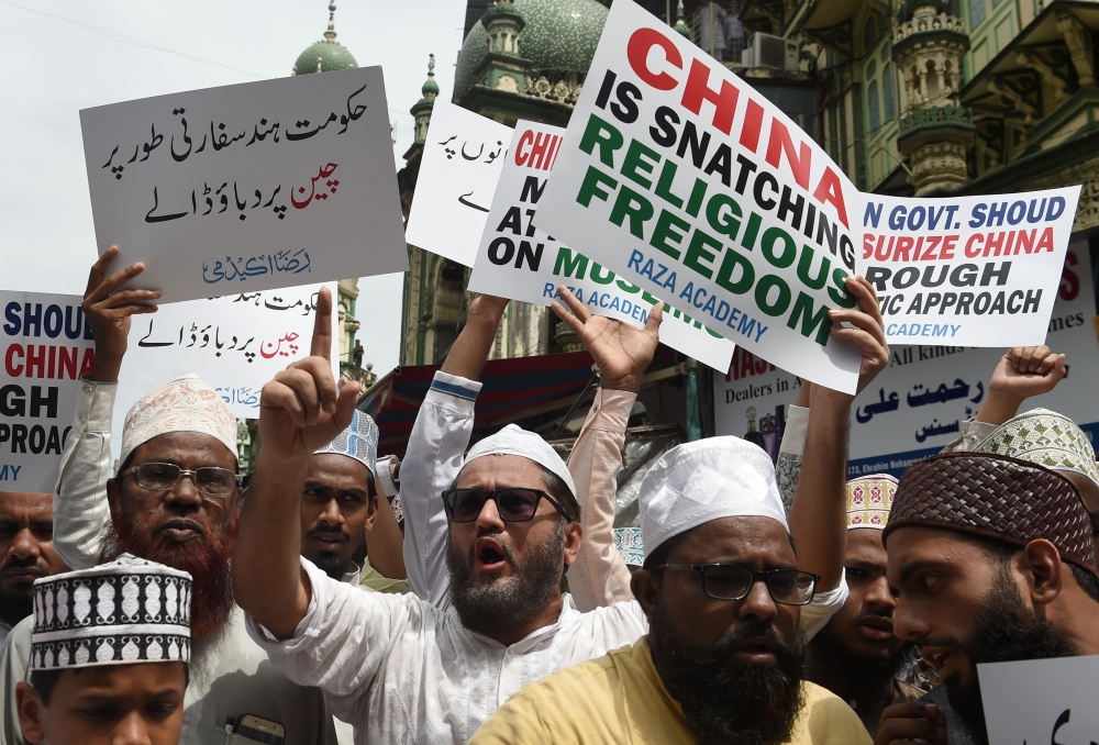 Indian Muslims hold placards in Mumbai during a protest against the Chinese government over the detention of Muslim minorities in Xinjiang in this Sept. 14, 2018 file photo. — AFP