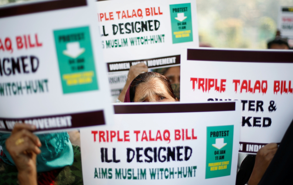 Muslim women hold placards during a protest against a bill that aims at prosecuting Muslim men who divorce their wives through the “triple talaq,” or instant divorce, in New Delhi in this Jan. 4, 2018 file photo. — Reuters