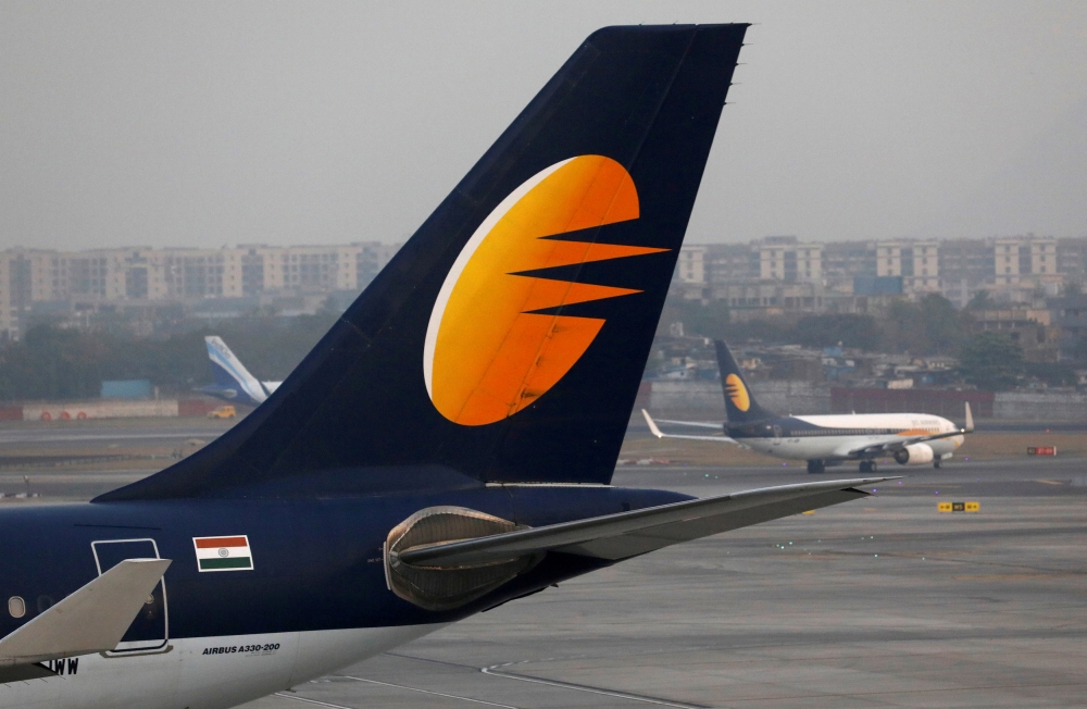 A Jet Airways plane is parked as other moves to runway at the Chhatrapati Shivaji International airport in Mumbai, India, in this Feb. 14, 2018 file photo. — Reuters