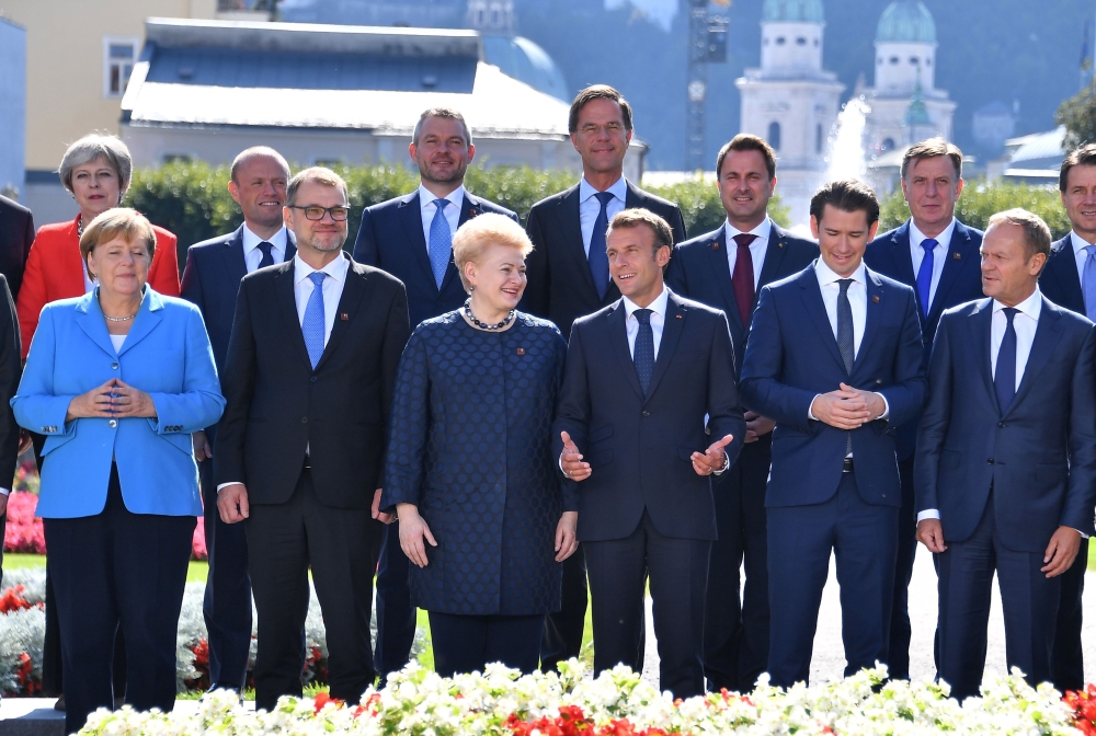 Participants pose for a family photo at the Mirabellgarten garden in front of the Mozarteum University during the EU Informal Summit of Heads of State or Government in Salzburg, Austria, on Thursday. — AFP