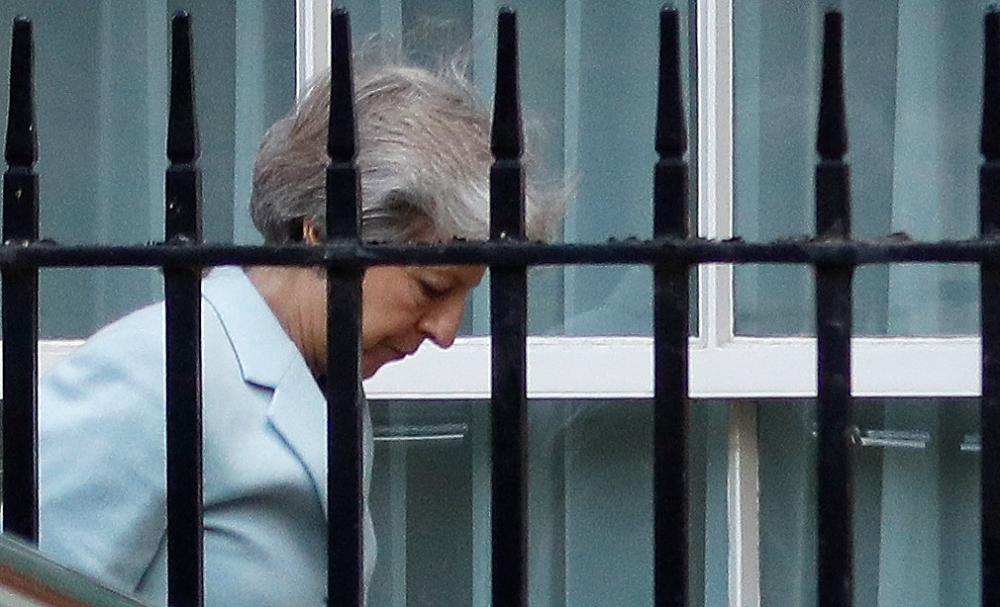 Britain’s Prime Minister Theresa May arrives at the back entrance of 10 Downing Street in London on Friday. — Reuters