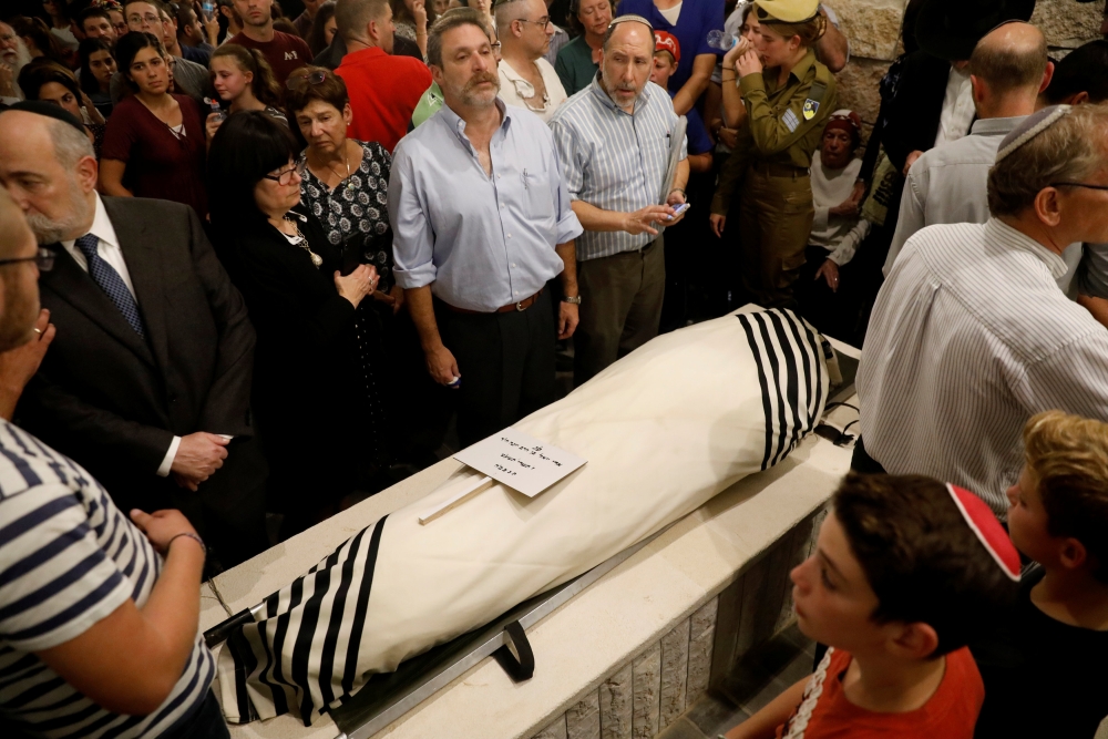 Relatives and friends mourn during the funeral of Ari Fuld, 45, an American-born Jewish settler fatally stabbed by a Palestinian, at a cemetery in Kfar Etzion in the occupied West Bank in this Sept. 17, 2018 file photo. — Reuters