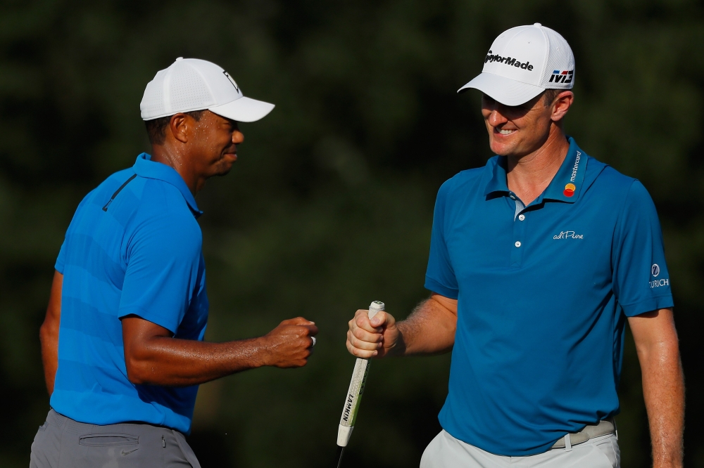 


Tiger Woods of the US reacts with Justin Rose of England on the 16th green during the third round of the Tour Championship at East Lake Golf Club in Atlanta Saturday. — AFP 