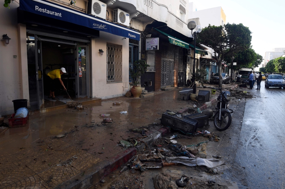 
Debris filled streets in the town center in the Tunisian coastal city of Nabeul following deadly flash flooding, Sunday. — AFP

  / AFP / FETHI BELAID