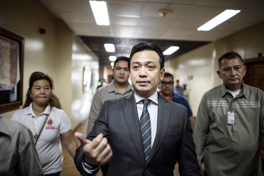 


Philippines Senator Antonio Trillanes arrives at the senate building in Manila on Tuesday. — AFP
