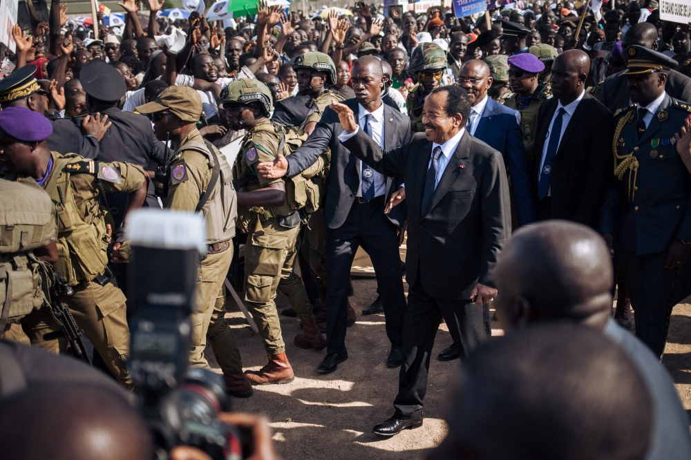 Cameroon's President Paul Biya (center) greets supporters during an electoral meeting at the stadium in Maroua during his visit in the Far North Region of Cameroon, Saturday. — AFP