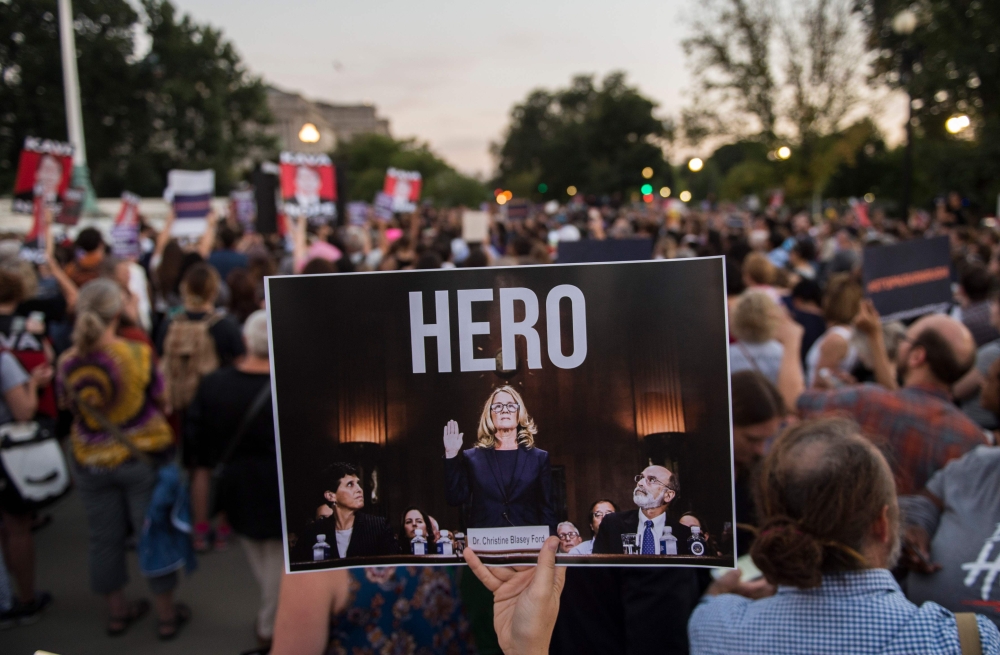 Activists take part in a protest against US Supreme Court nominee Brett Kavanaugh in Washington on Wednesday. — AFP