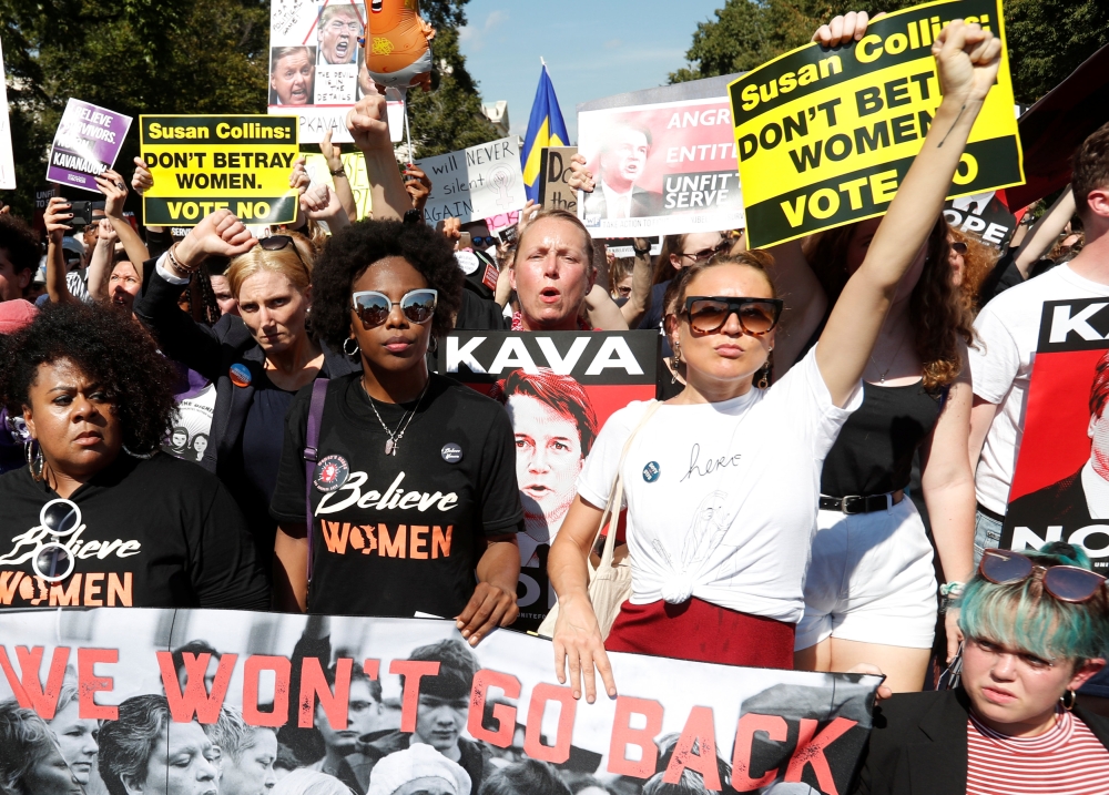 Activists march during a rally in opposition to US Supreme Court nominee Brett Kavanaugh in Washington on Thursday. — Reuters