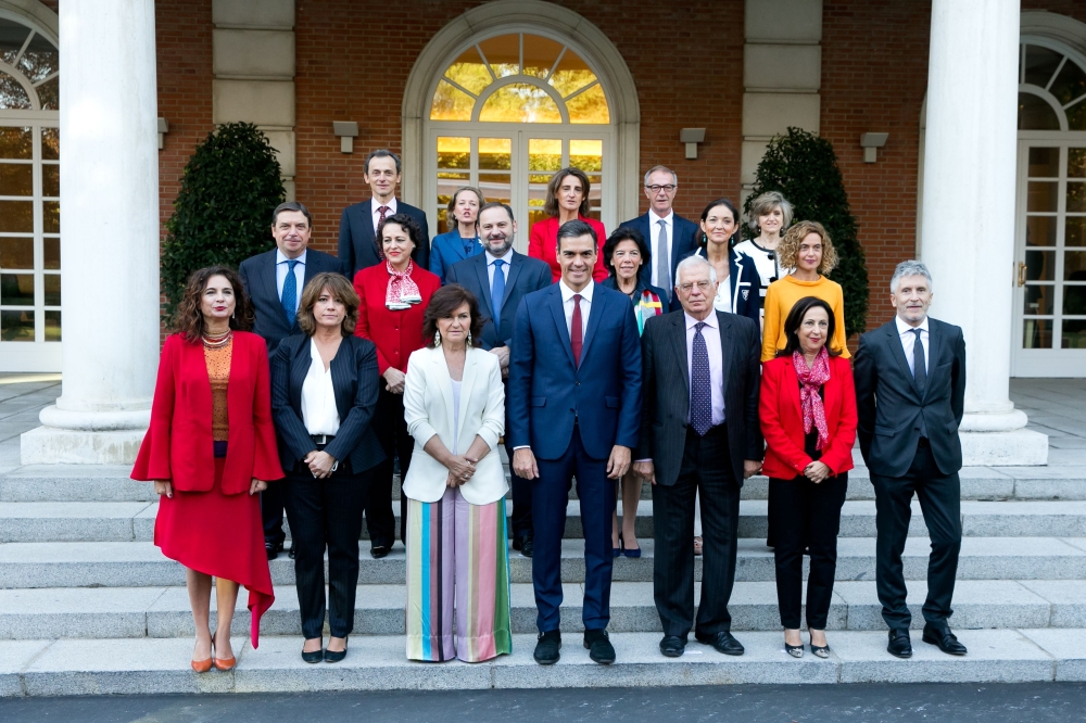 Spanish Prime Minister Pedro Sanchez, center, poses with members of his government pose for a group picture at the Moncloa Palace in Madrid on Friday. — AFP