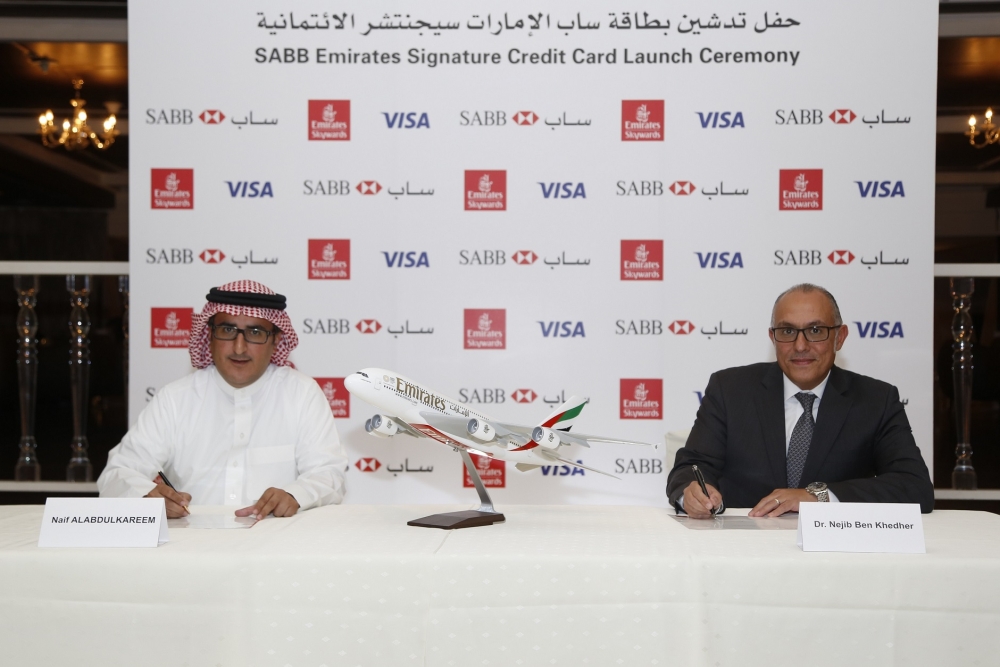 Naif Alabdulkareem, SABB General Manager Retail Banking and Dr Nejib Ben Khedher, Senior Vice President, Emirates Skywards, sign the agreement in Riyadh
