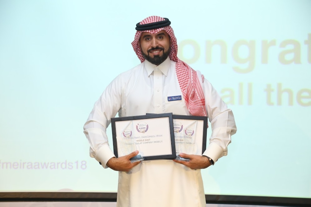 


Tareq Al Angari, Executive General Manager of Investor Relations at Mobily, shows off the awards