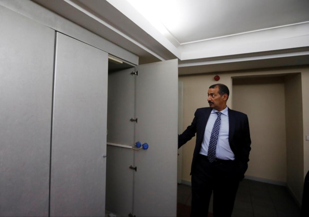 Consul General of Saudi Arabia Mohammad Al-Otaibi opens a cupboard as he gives a tour of Saudi Arabia’s consulate in Istanbul to journalists to prove that Jamal Khashoggi is not on the premises. — Reuters