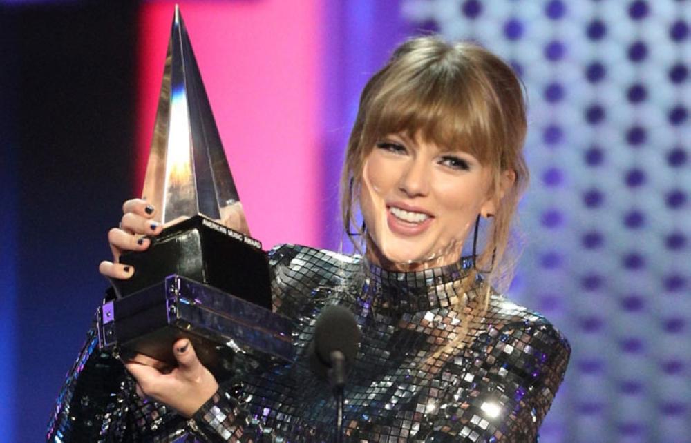 Taylor Swift accepts the Artist of the Year award onstage during the 2018 American Music Awards at Microsoft Theater on Tuesday in Los Angeles, California. — AFP