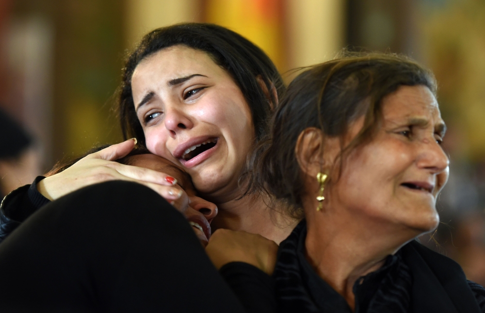 Women mourn for the victims of the blast at the Coptic Christian Saint Mark’s church in Alexandria the previous day during a funeral procession at the Monastery of Marmina in the city of Borg El-Arab, east of Alexandria, in this April 10, 2017 file photo. — AFP