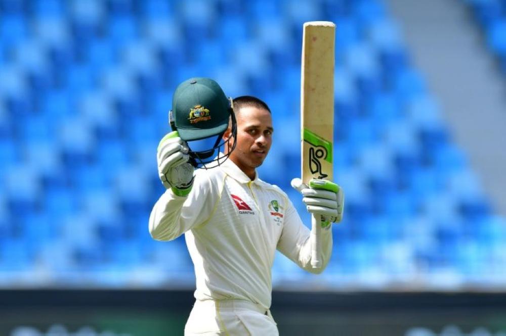 Opener Usman Khawaja hit a fighting hundred to foil Pakistan and help Australia escape with a draw in the first Test in Dubai.