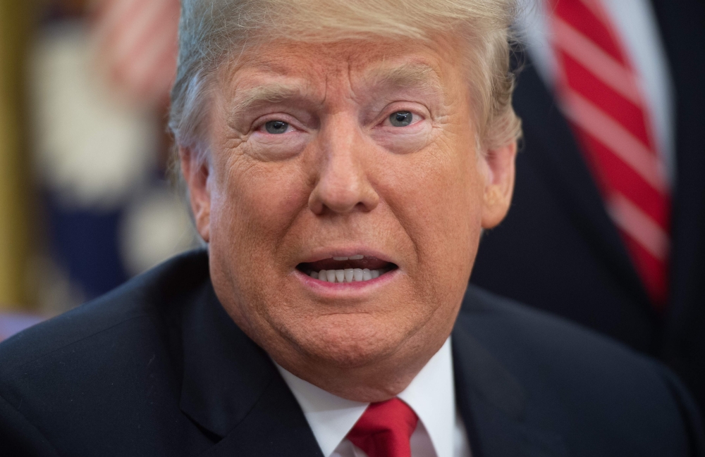 A coalition of US business groups fighting President Donald Trump's trade tariffs has launched an advertisement aimed at telling voters ahead of the midterm elections that the measures are costing American businesses and consumers $1.4 billion a month. Trump is seen at the Oval Office. — AFP