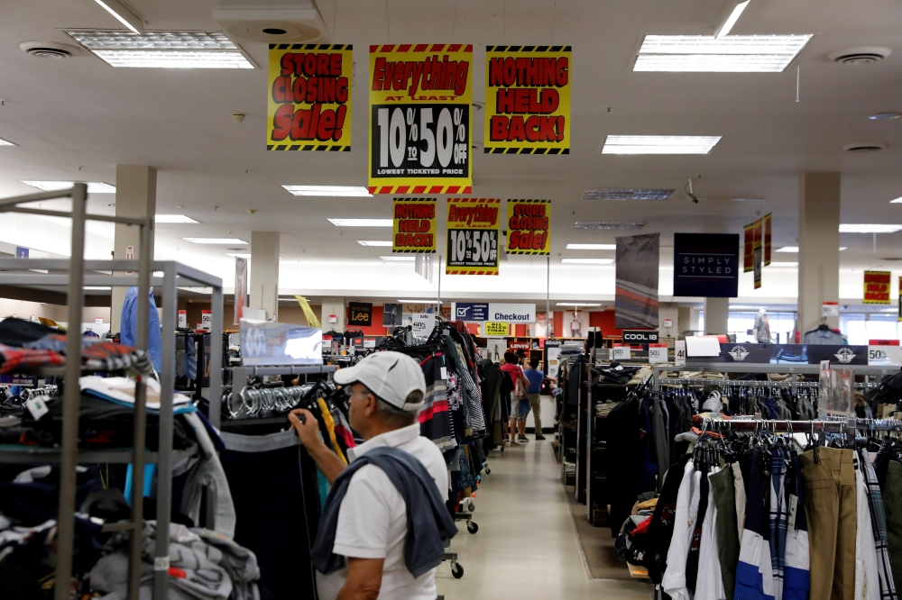 Store closing signs advertising discounts at a Sears in New Hyde Park, New York, US, in this file photo. — Reuters