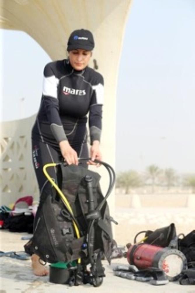 Maryam Al-Muallim, a Saudi female divemaster wears her diving equipment at Half Moon Beach open-water dive site in Dhahran, Saudi Arabia, on Sept. 15, 2018. — Reuters