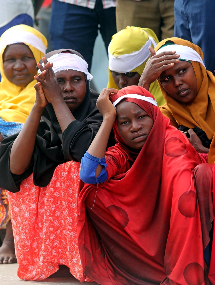Civilians gather near the scene to mark the first anniversary of a terror attack in the Hodan district of Mogadishu, Somalia, on Sunday. — Reuters
