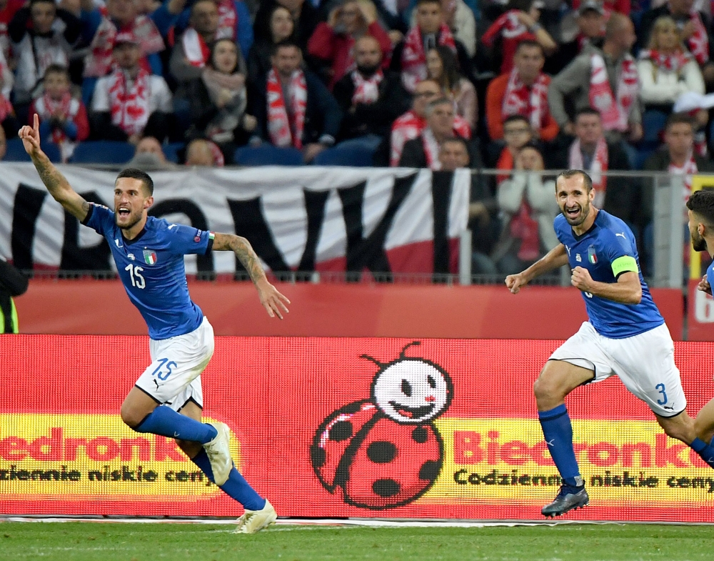 


Italy's defender Cristiano Biraghi (L) celebrates scoring with Italy's defender Giorgio Chiellini during the UEFA Nations League football match against Poland at the Silesian Stadium in Chorzow, Poland, on Sunday. — AFP