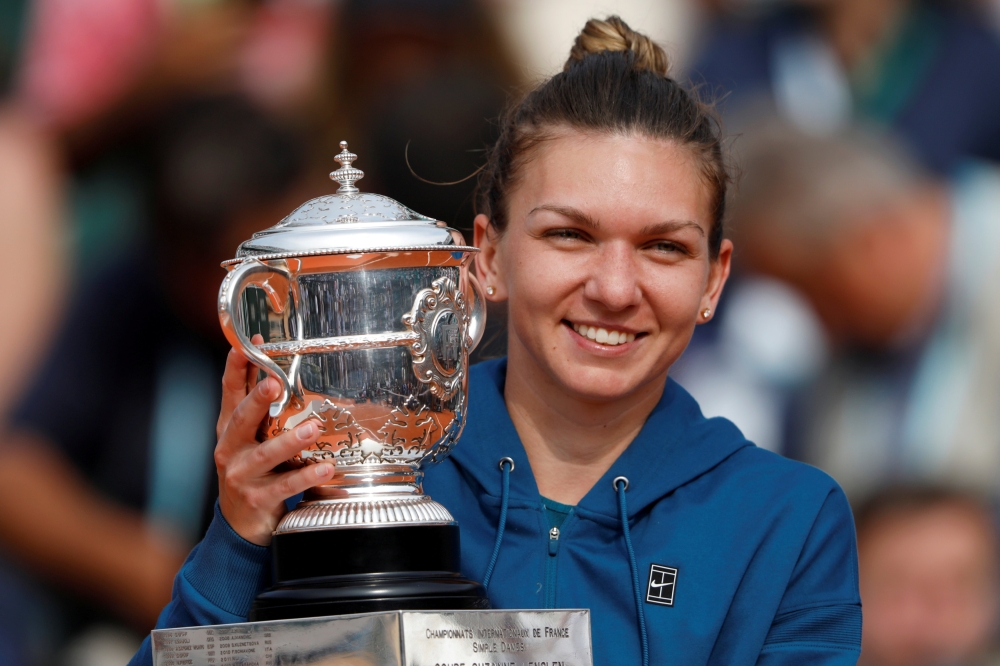 


Romania’s Simona Halep celebrates with the French Open trophy at Roland Garros, Paris, France in this file photo. — Reuters