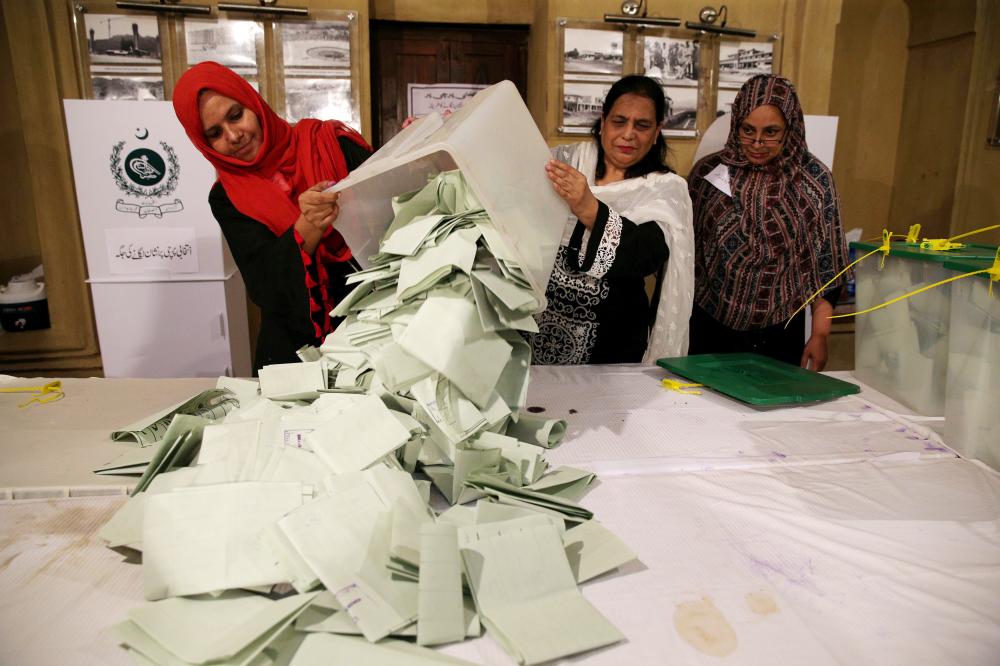 


Election officials count ballots after polls closed during the general election in Islamabad, Pakistan, in this July 25, 2018 file photo. — Reuters