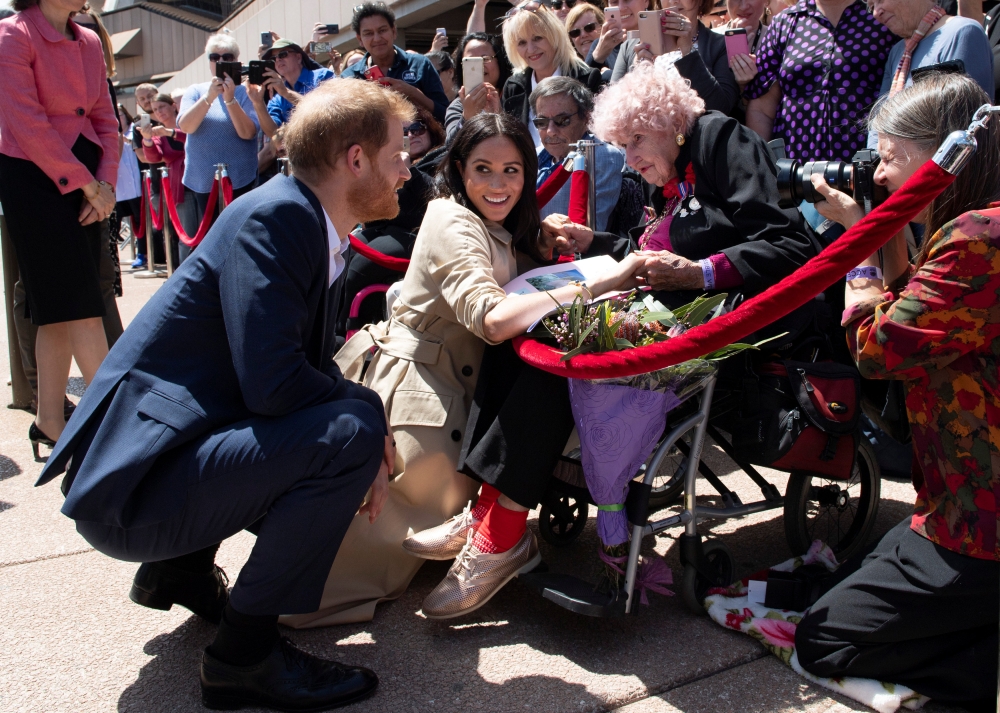 


Meghan, Duchess of Sussex and Prince Harry, Duke of Sussex meet Daphne Dunne during a visit at the Sydney Opera House in Sydney, Australia, on Tuesday. — Reuters