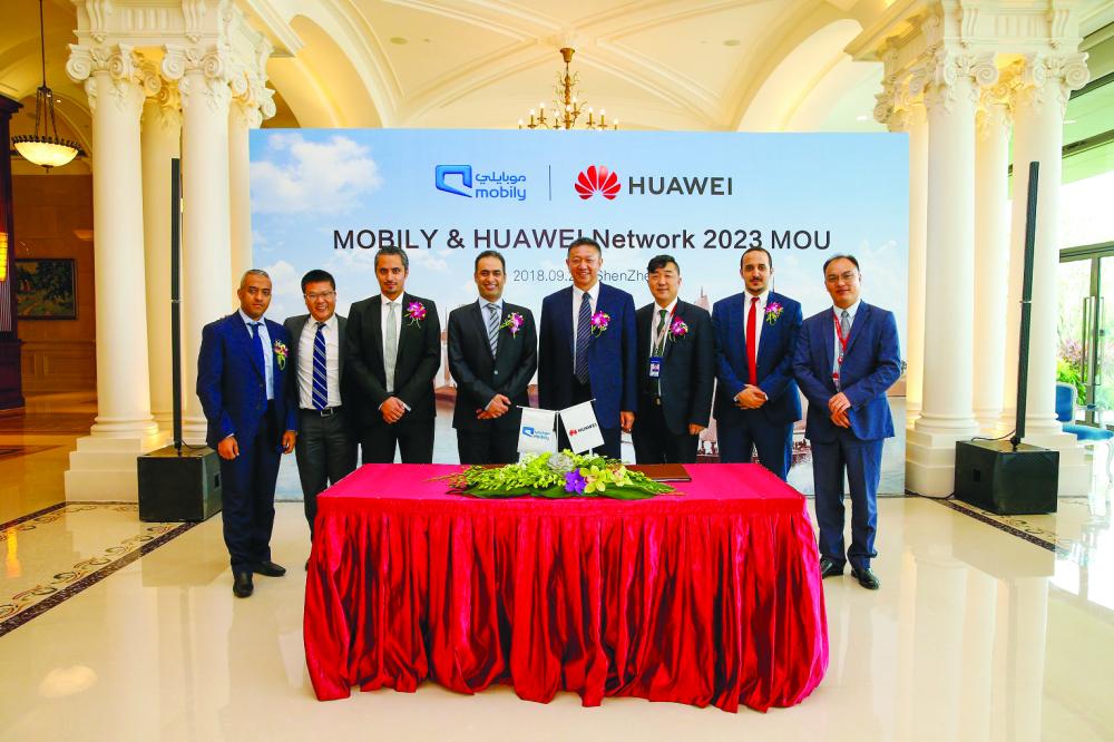 



Huawei and Mobily executives pose for a group photo at the signing of MoU