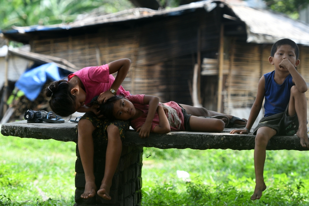


Bhutanese refugee children are seen in the Beldangi refugee camp in Damak, some 300 km southeast of Kathmandu, Nepal, in this Aug. 10, 2018 file photo. — AFP