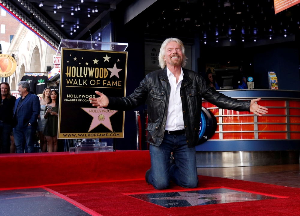 


Richard Branson poses by his star after it was unveiled on the Hollywood Walk of Fame in Los Angeles, California, US, on Tuesday. — Reuters