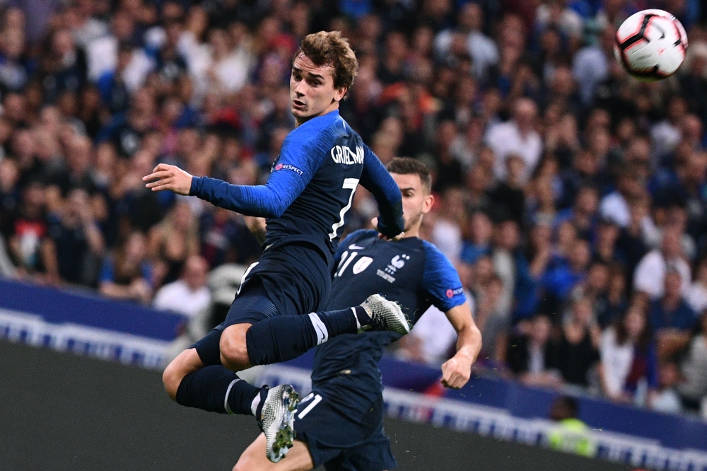 


France’s forward Antoine Griezmann heads the ball during the UEFA Nations League football match against Germany at the Stade de France in Saint-Denis, near Paris, Tuesday. — AFP