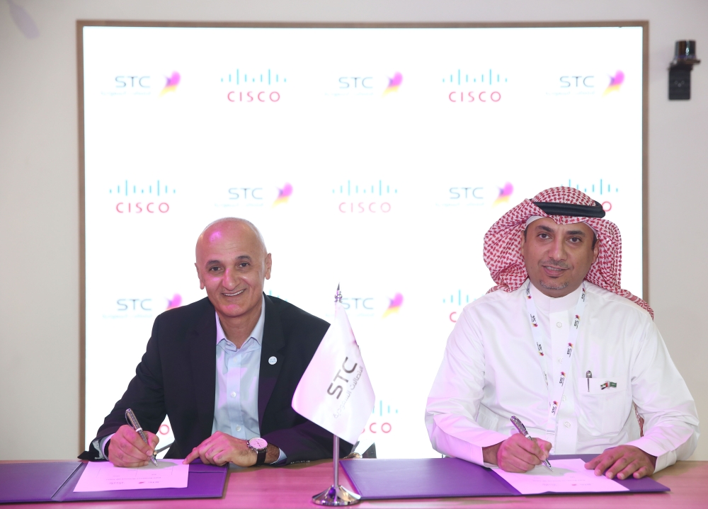 (From left) Dr. Fahad Mushayt, CEO, STC Specialized; and Amr K. El Leithy, Head of the MEA market, Nokia, sign MoU. In the background (left to right) Dr. Tarig Enaya, Senior VP of Enterprise Business Unit at STC; Waseem Al-Marzogi, Head of the STC customer business team at Nokia; and Bernard Najm, Head of the Middle East Market Unit, Nokia