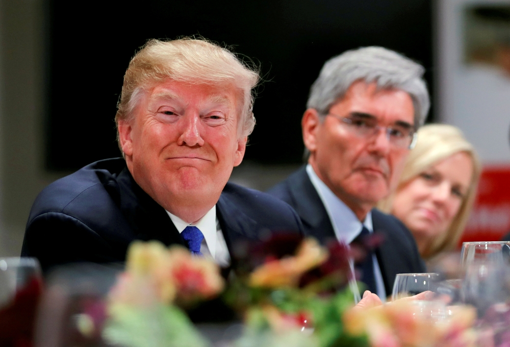 File photo shows US President Donald Trump attendinga dinner with business men and CEO's during the World Economic Forum (WEF) annual meeting in Davos, Switzerland. Siemens CEO's Joe Kaeser (C) looks on. — Reuters